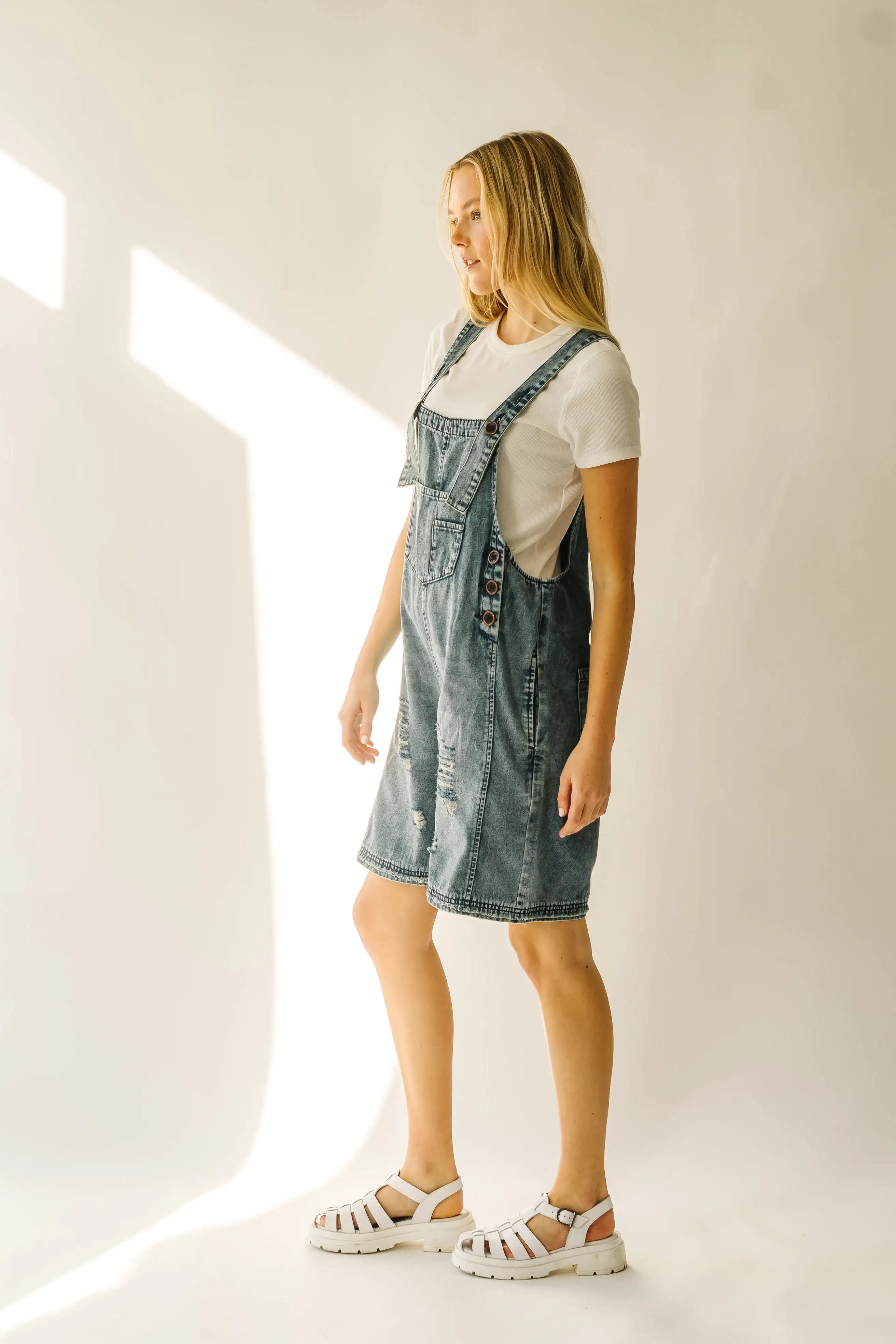 The Dearing Washed Denim Shorts Romper in Vintage Denim