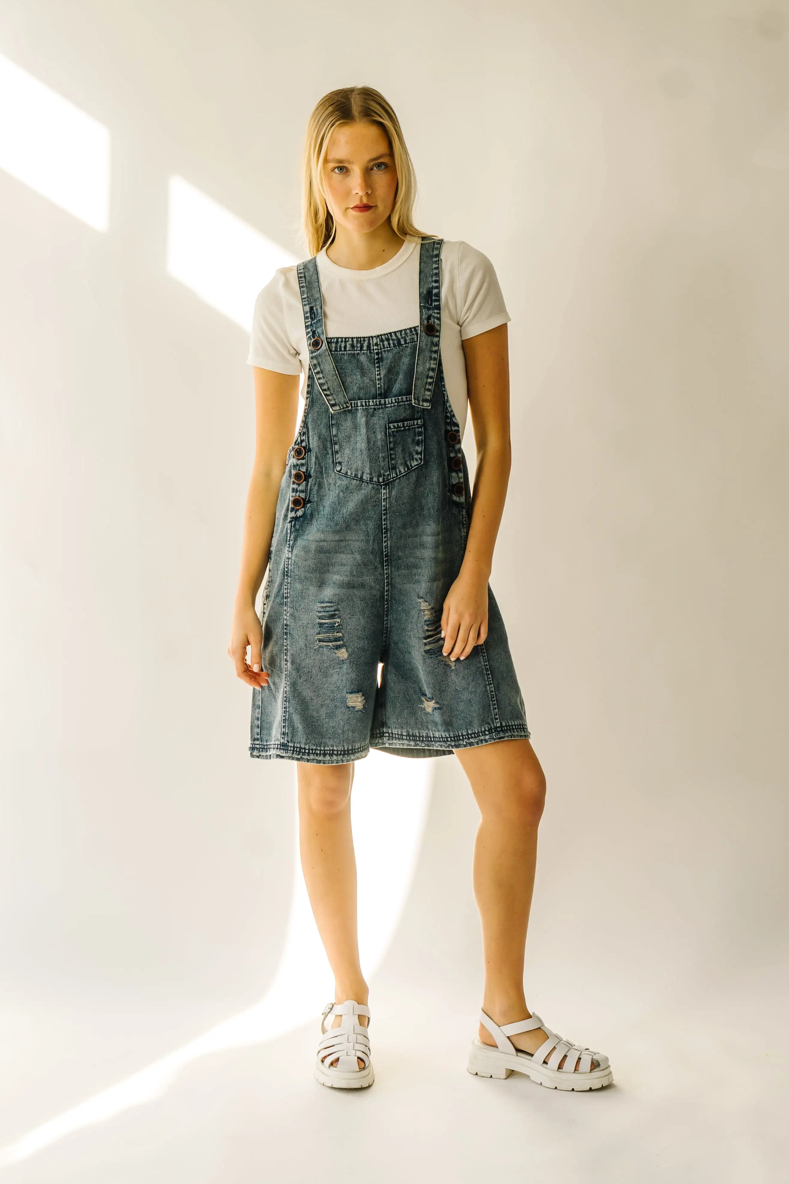 The Dearing Washed Denim Shorts Romper in Vintage Denim