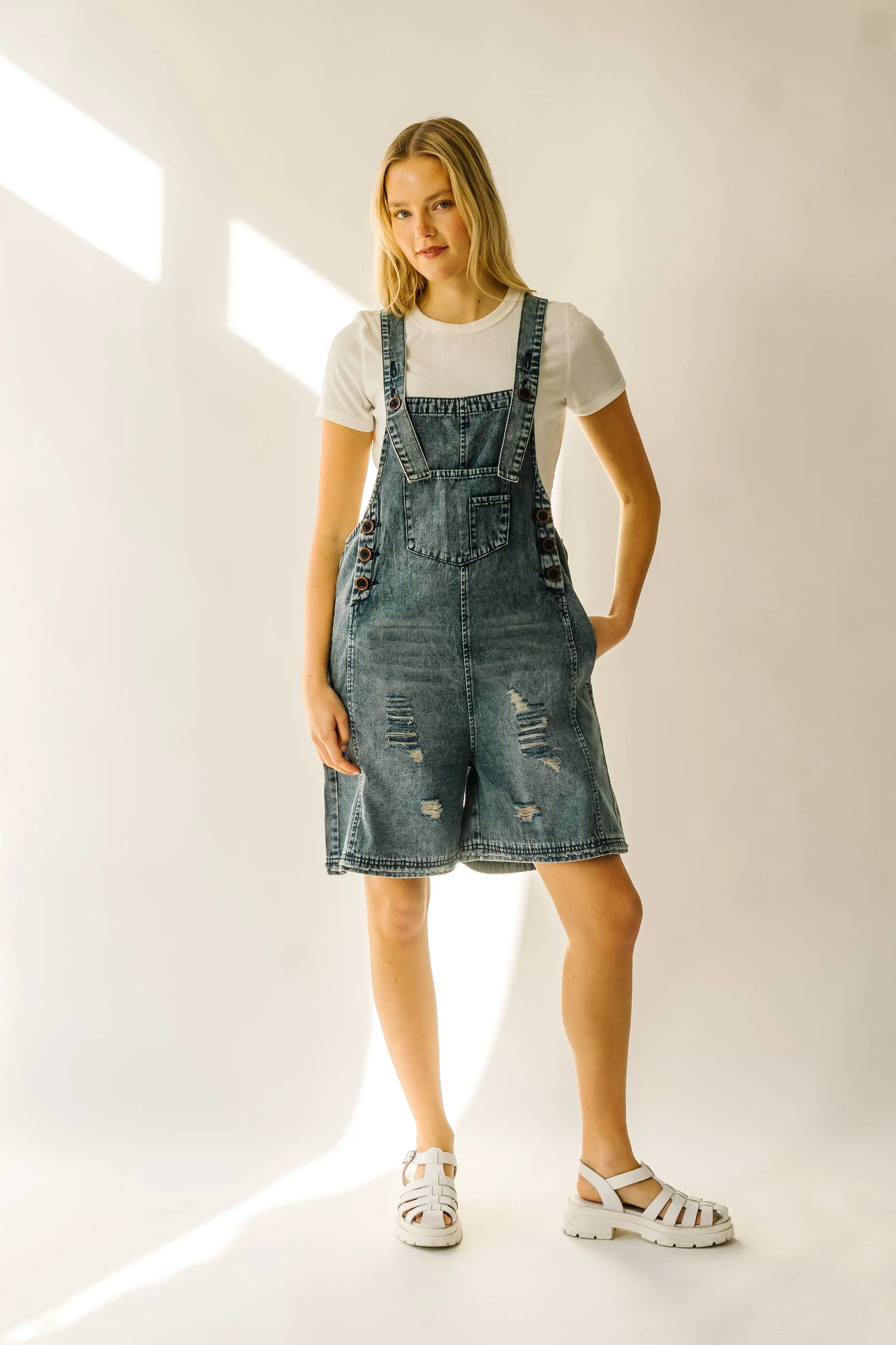 The Dearing Washed Denim Shorts Romper in Vintage Denim