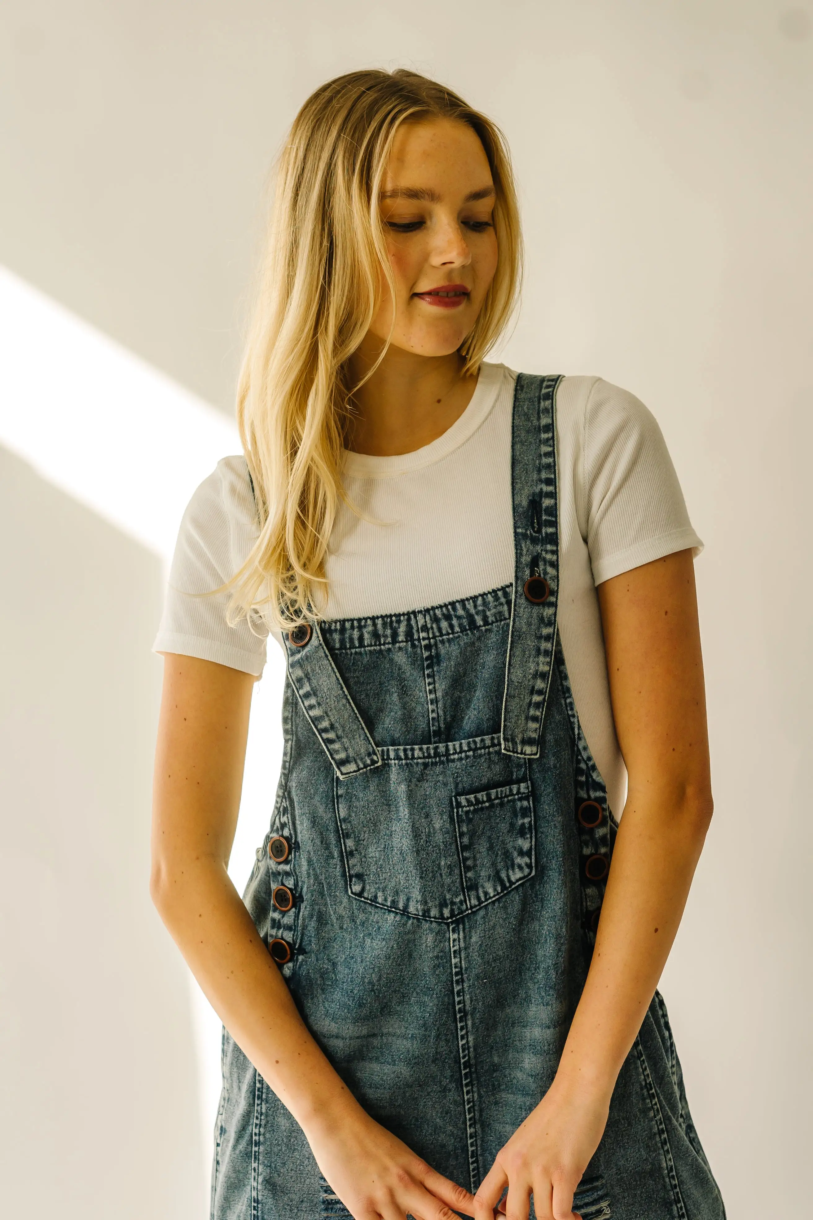 The Dearing Washed Denim Shorts Romper in Vintage Denim